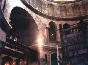 Pilgrim make photo of the Holy Light column (center) and balls of Holy Light (bottom-left)